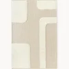 Alfombra artesanal con relieve y flecos Laine