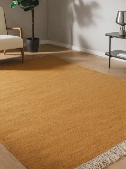 Alfombra artesanal de lana con flecos Liv