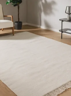 Alfombra artesanal de lana con flecos Liv
