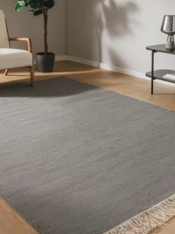 Alfombra artesanal de lana con flecos Liv
