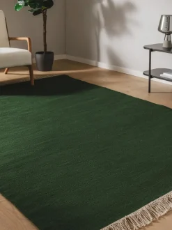 Alfombra artesanal de lana con flecos Liv
