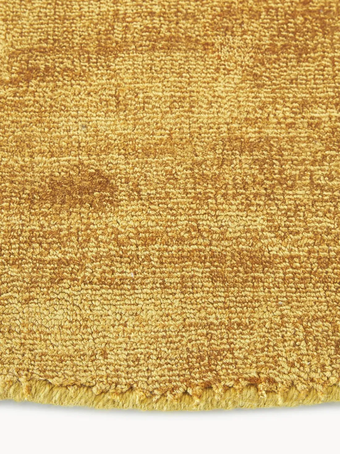 Alfombra redonda artesanal de viscosa Jane