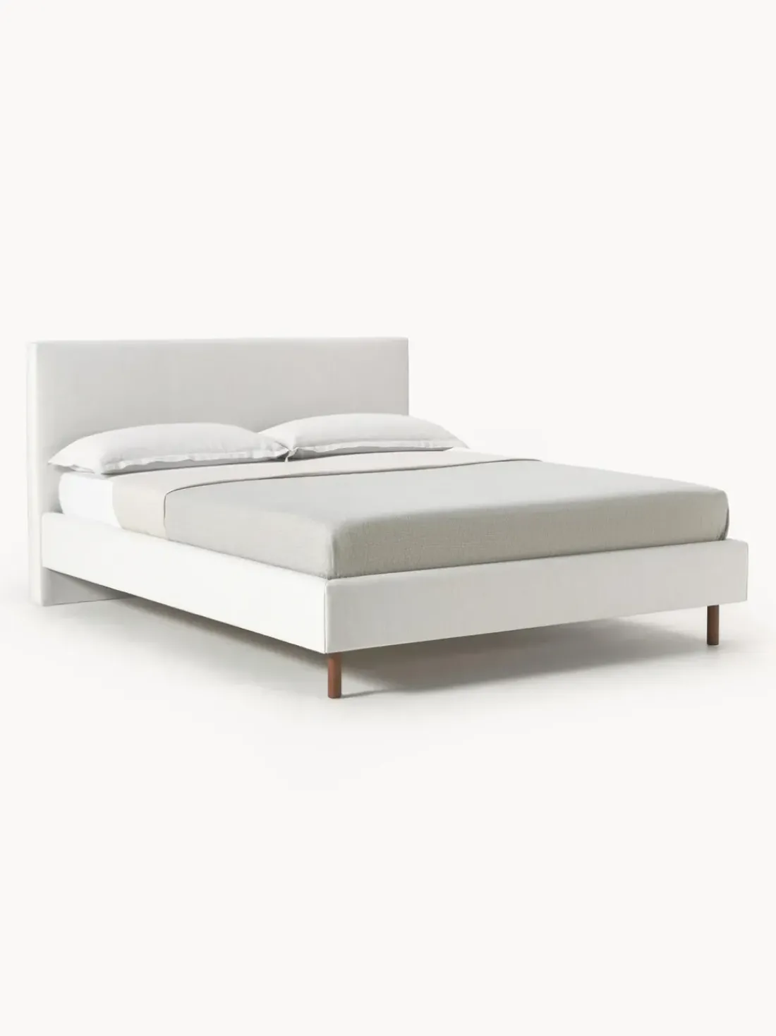 Cama tapizada con patas de madera Giulia