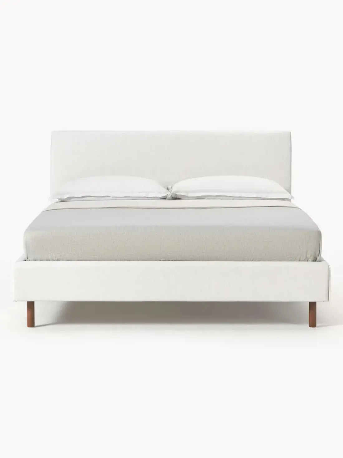 Cama tapizada con patas de madera Giulia