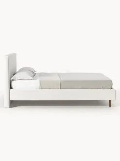 Cama tapizada con patas de madera Giulia