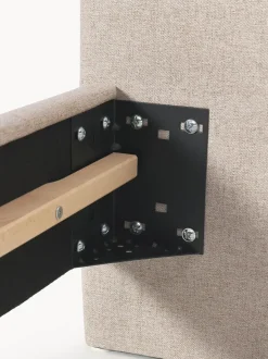 Cama tapizada con patas de madera Giulia