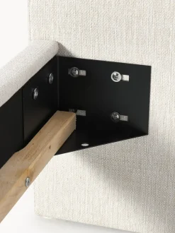 Cama tapizada con patas esféricas de madera Rena