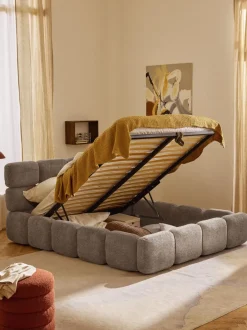 Cama tapizada de boreguillo bouclé con espacio de almacenamiento Tayla