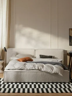 Cama tapizada en tejido bouclé Lennon, con espacio de almacenamiento