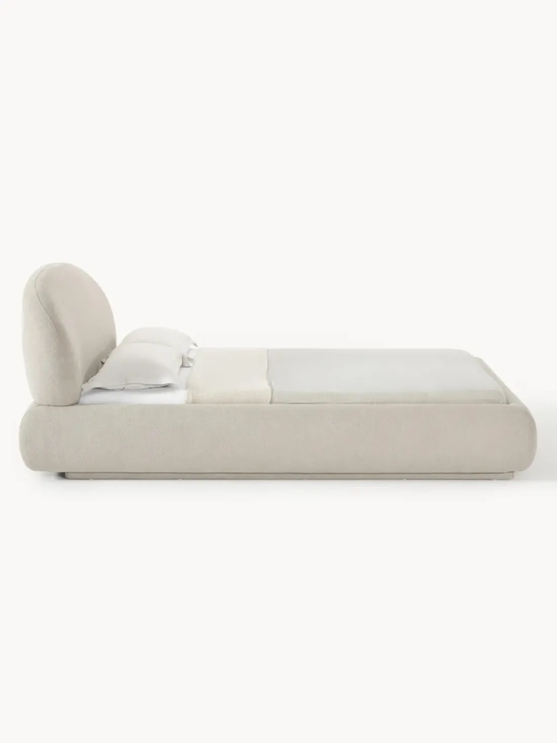 Cama tapizada redondeada en tejido bouclé Alba