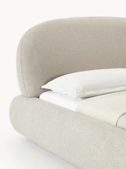 Cama tapizada redondeada en tejido bouclé Alba