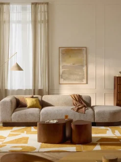 Diván modular de borreguillo bouclé con reposapiés Natalie