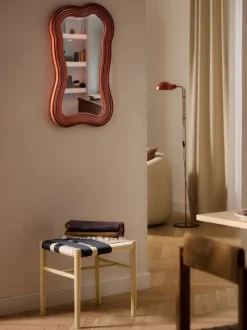 Espejo de pared con marco ondulado Cosimo
