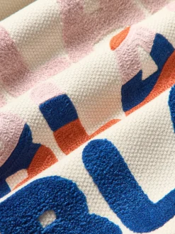 Funda de cojín reversible con inscripción bordada Blah Blah