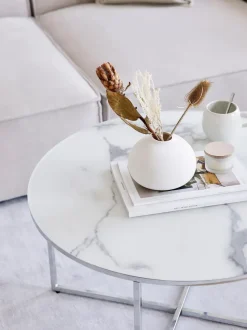 Mesa de centro redonda con tablero de vidrio en look mármol Antigua
