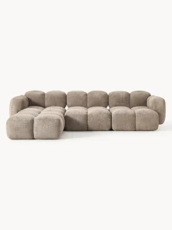 Sofá modular de borreguillo bouclé con reposapiés Tayla (4 plazas)