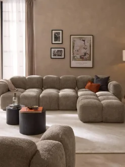 Sofá modular de borreguillo bouclé con reposapiés Tayla (4 plazas)