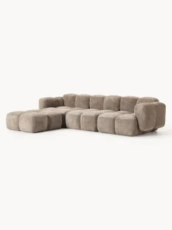 Sofá modular de borreguillo bouclé con reposapiés Tayla (4 plazas)