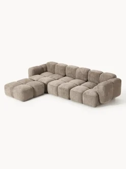 Sofá modular de borreguillo bouclé con reposapiés Tayla (4 plazas)