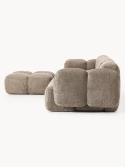 Sofá modular de borreguillo bouclé con reposapiés Tayla (4 plazas)