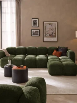 Sofá modular de borreguillo bouclé con reposapiés Tayla (4 plazas)