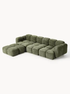 Sofá modular de borreguillo bouclé con reposapiés Tayla (4 plazas)