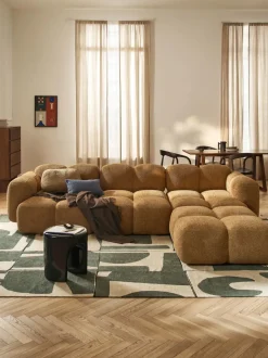 Sofá modular de borreguillo bouclé con reposapiés izquierdo/derecho Tayla (4 plazas)