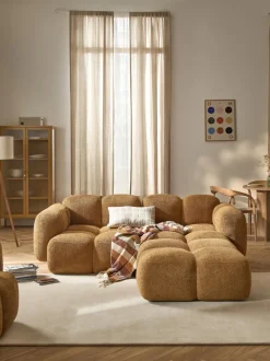 Sofá modular de borreguillo bouclé con reposapiés izquierdo/derecho Tayla (3 plazas)