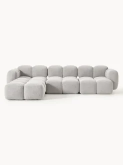 Sofá modular en tejido bouclé con reposapiés Tayla (4 plazas)