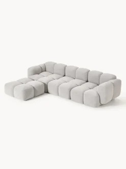 Sofá modular en tejido bouclé con reposapiés Tayla (4 plazas)