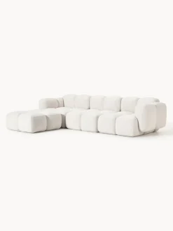 Sofá modular en tejido bouclé con reposapiés Tayla (4 plazas)