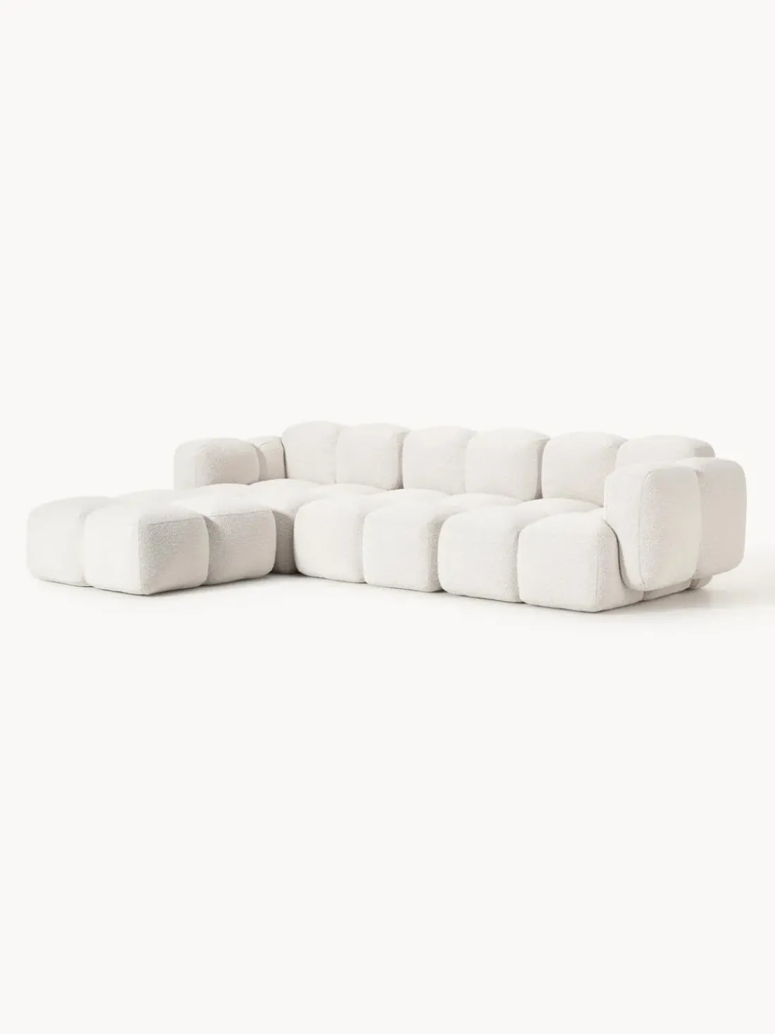 Sofá modular en tejido bouclé con reposapiés Tayla (4 plazas)