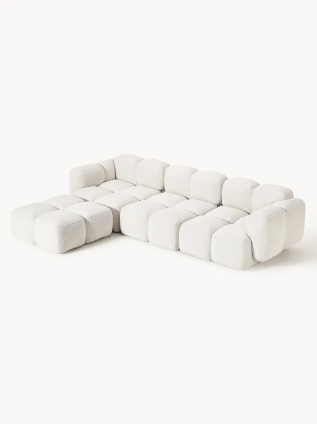 Sofá modular en tejido bouclé con reposapiés Tayla (4 plazas)