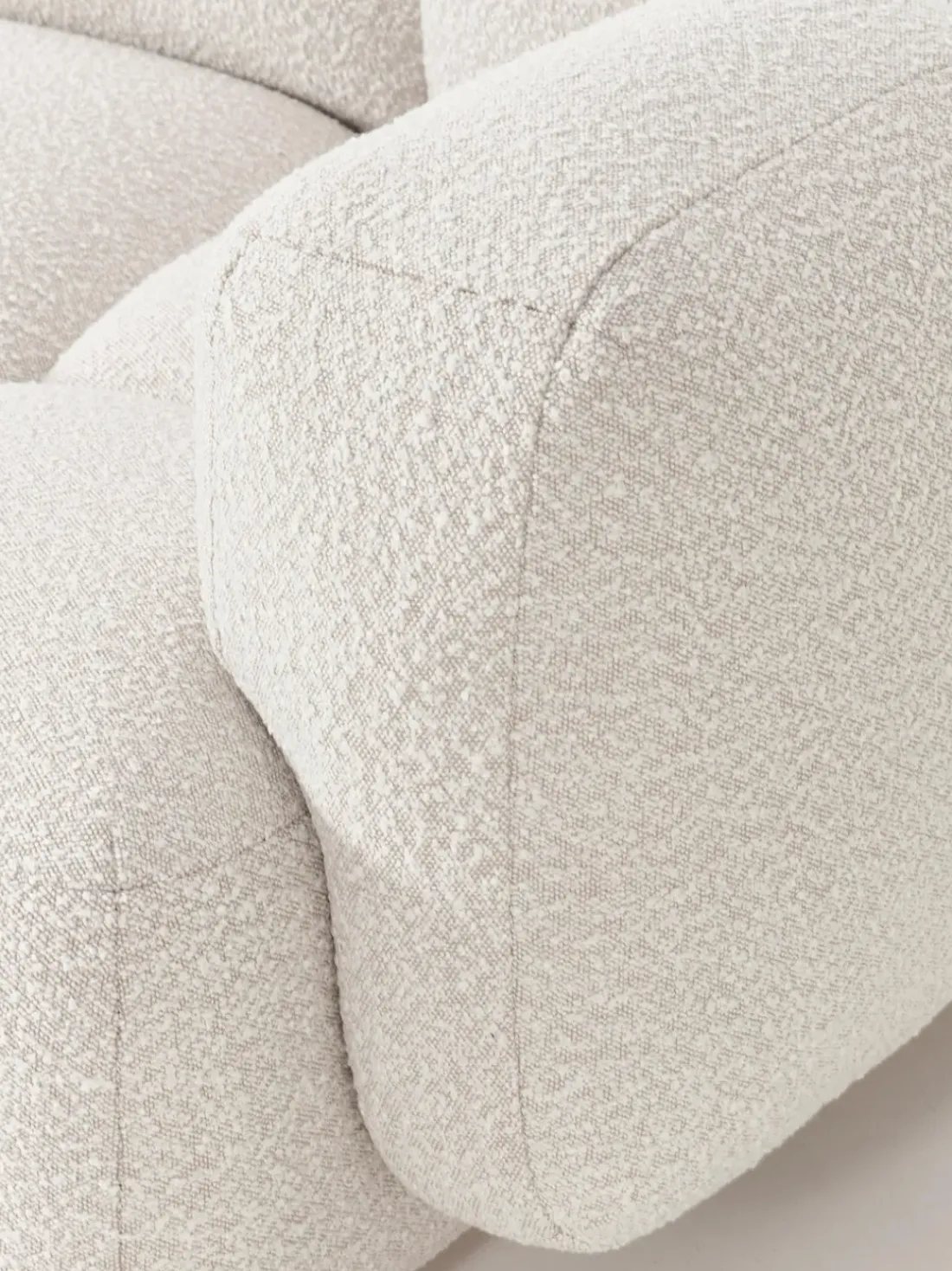 Sofá modular en tejido bouclé con reposapiés Tayla (4 plazas)