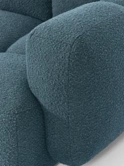Sofá modular en tejido bouclé con reposapiés Tayla (3 plazas)