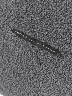 Westwing | Crosby Studios, cojín redondo en tejido bouclé Celeste, Ø 70 cm
